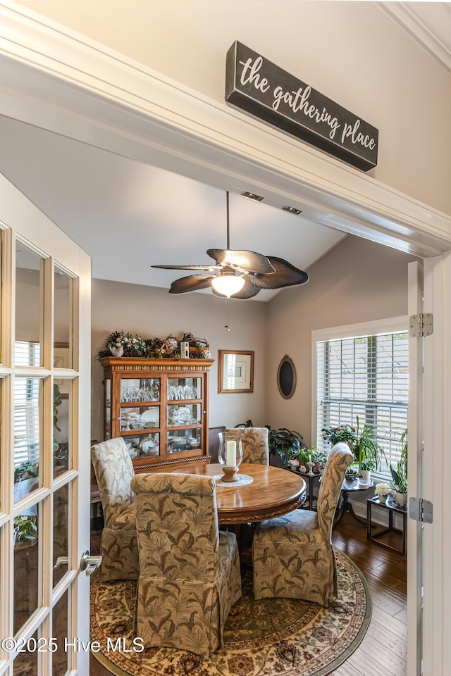 dining room with ceiling fan and hardwood / wood-style flooring