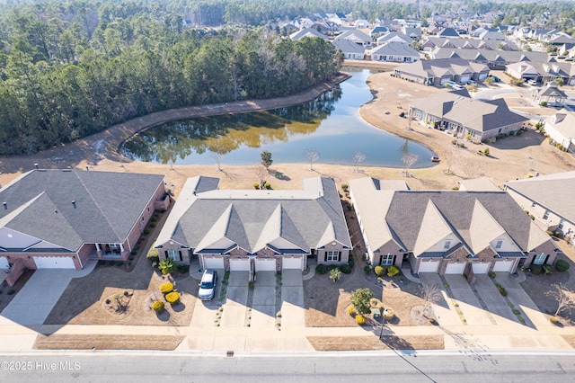 aerial view with a water view and a residential view