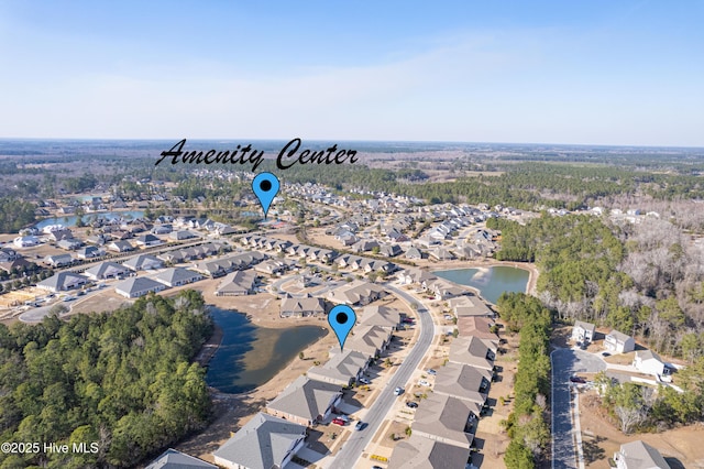 drone / aerial view featuring a water view and a residential view