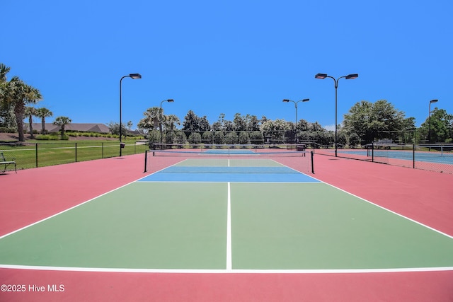 view of sport court with community basketball court and fence
