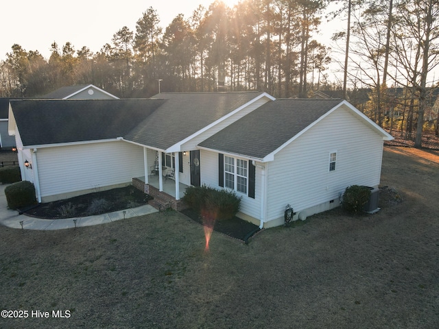 ranch-style home featuring crawl space, a front lawn, and roof with shingles