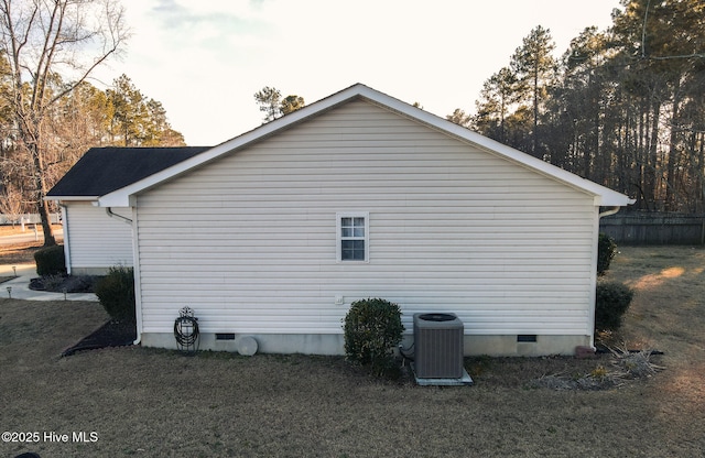 view of side of home featuring crawl space and central air condition unit