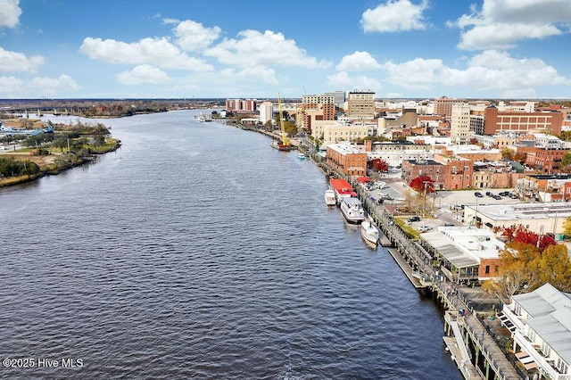 birds eye view of property with a view of city and a water view