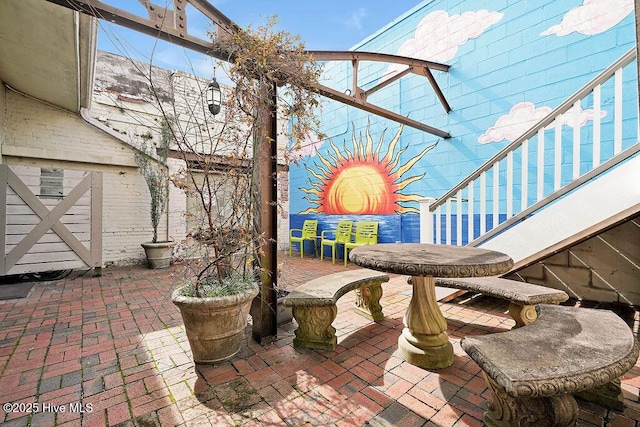 view of patio / terrace featuring stairs