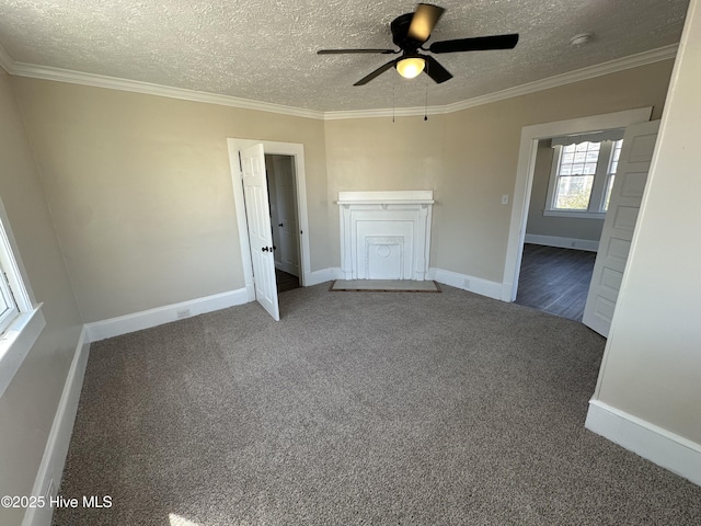 interior space with dark colored carpet and ornamental molding