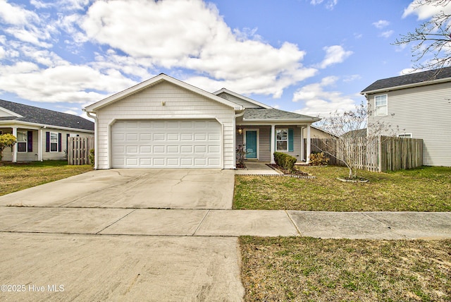 view of front of home with a front yard, fence, driveway, and an attached garage