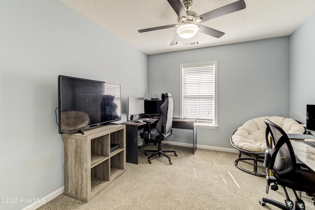 home office with carpet, baseboards, and a textured ceiling