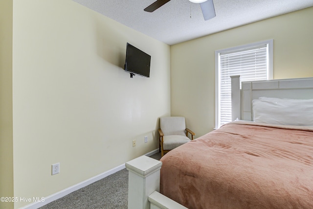 bedroom with carpet flooring, ceiling fan, a textured ceiling, and baseboards