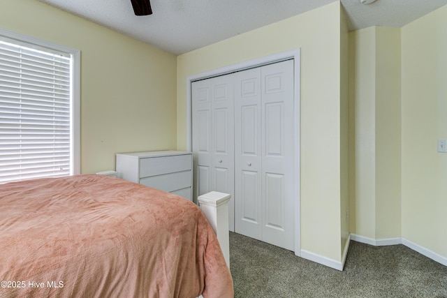 bedroom featuring a ceiling fan, a closet, carpet flooring, and baseboards