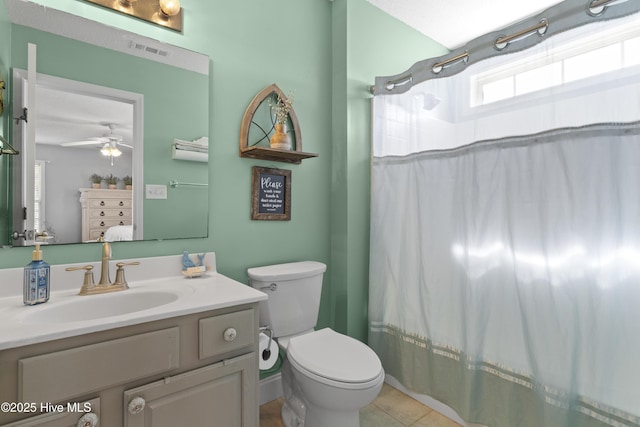 full bathroom with toilet, vanity, visible vents, a shower with curtain, and tile patterned floors