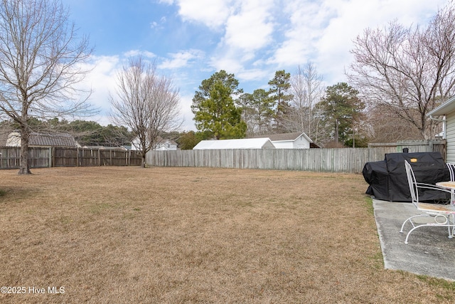 view of yard with a fenced backyard