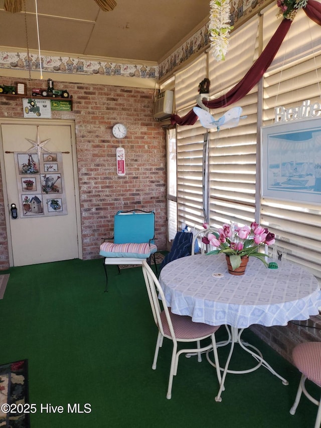 view of patio / terrace with an AC wall unit