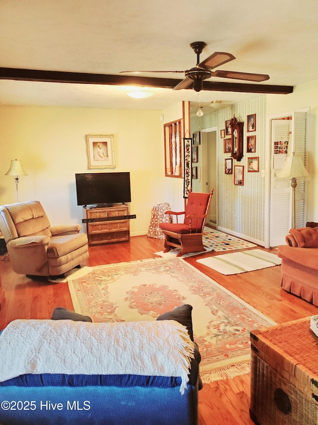 living room featuring ceiling fan and wood finished floors