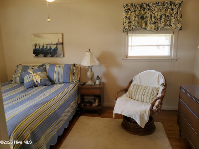 bedroom featuring wood finished floors