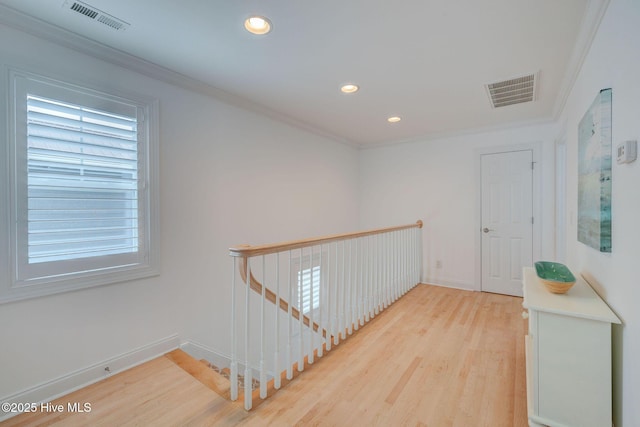 corridor featuring an upstairs landing, crown molding, wood finished floors, recessed lighting, and baseboards