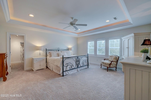 bedroom with a raised ceiling, light carpet, baseboards, recessed lighting, and crown molding