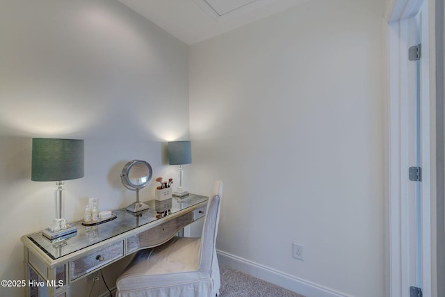 carpeted home office with baseboards