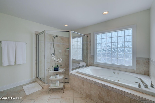 bathroom featuring a stall shower, a bath, tile patterned flooring, and recessed lighting