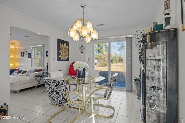 dining room with light tile patterned floors, ornamental molding, visible vents, and an inviting chandelier