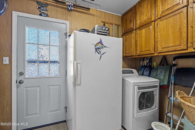 laundry room featuring cabinet space and washer / clothes dryer