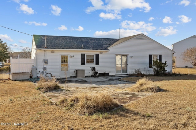 rear view of property with a patio area, fence, a lawn, and central AC unit