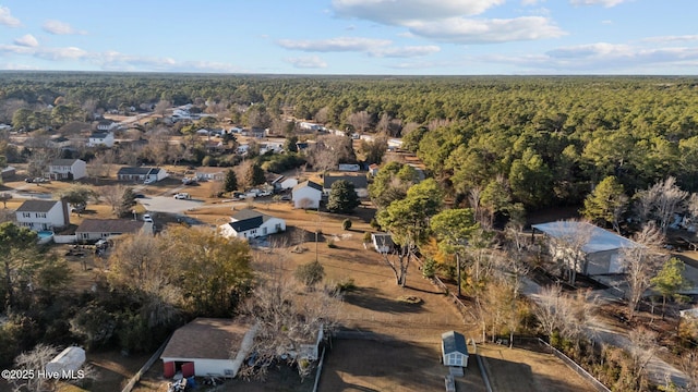 drone / aerial view featuring a view of trees