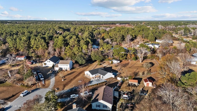 drone / aerial view featuring a forest view