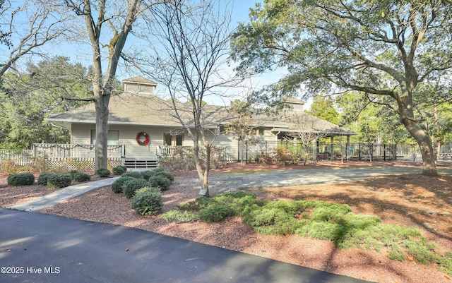 view of front of house with fence