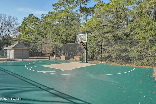 view of basketball court featuring community basketball court and fence