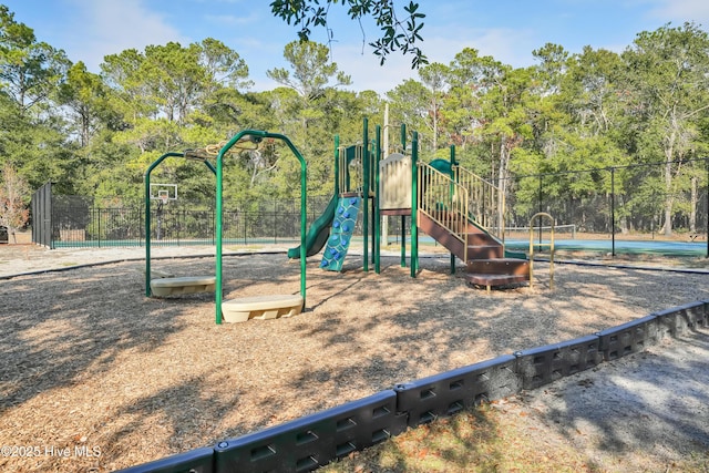 communal playground featuring fence