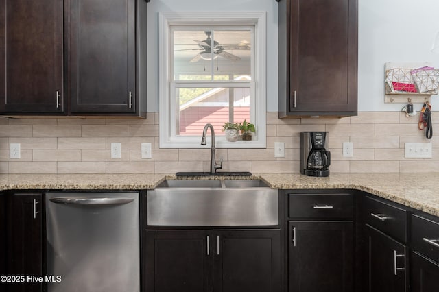 kitchen with dark brown cabinets, stainless steel dishwasher, a sink, and tasteful backsplash