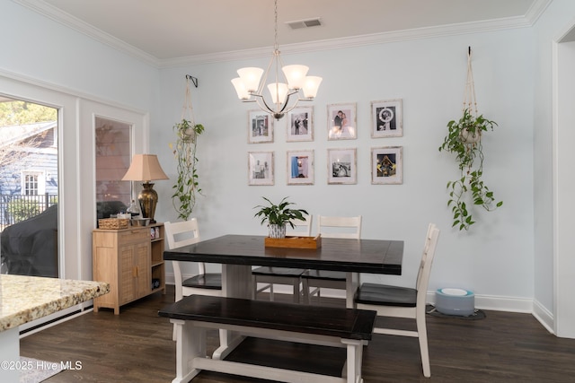 dining room with baseboards, visible vents, ornamental molding, dark wood-style flooring, and an inviting chandelier