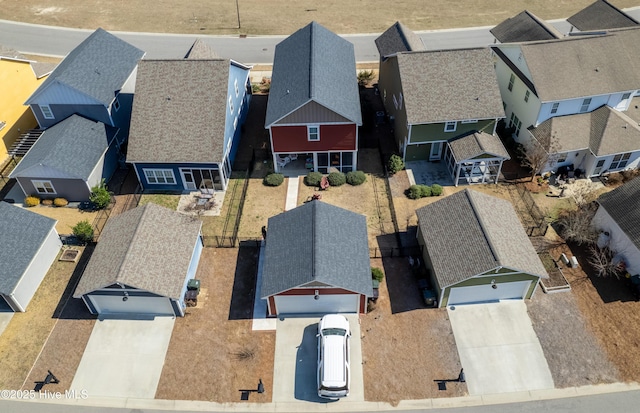 birds eye view of property with a residential view