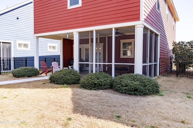 entrance to property featuring fence