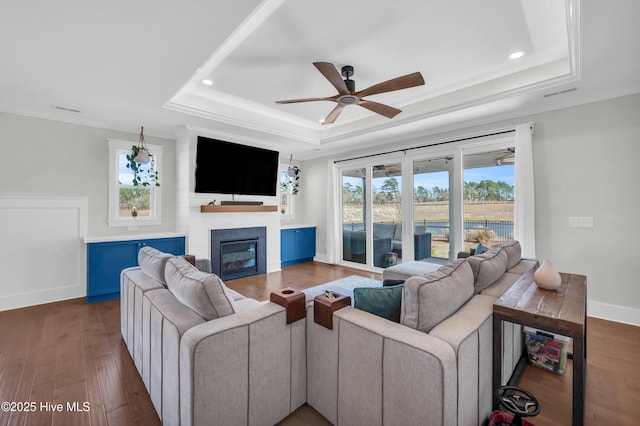 1066 Bradshaw Ter, Wilmington, NC 28412 - living room with wood finished floors, a fireplace, crown molding, a raised ceiling, and ceiling fan