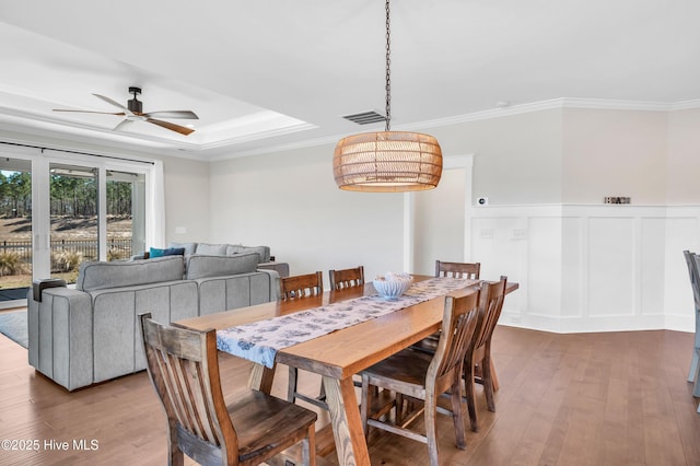 1066 Bradshaw Ter, Wilmington, NC 28412 - dining area with crown molding, visible vents, a ceiling fan, and hardwood / wood-style floors