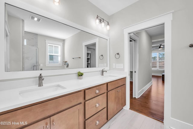 1066 Bradshaw Ter, Wilmington, NC 28412 - full bath with double vanity, a marble finish shower, visible vents, and a sink