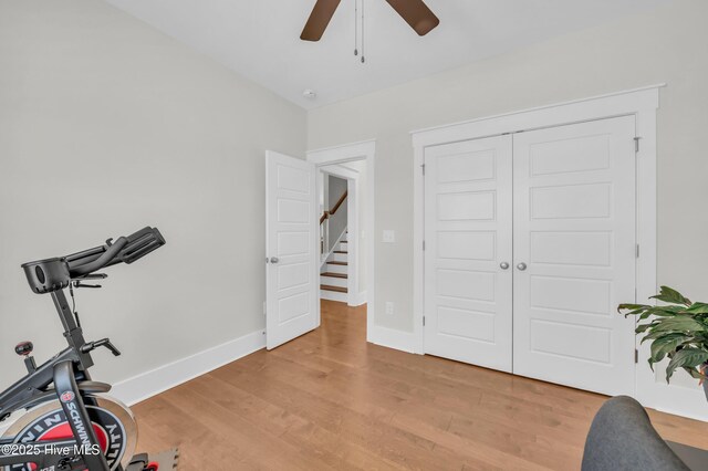 1066 Bradshaw Ter, Wilmington, NC 28412 - exercise room with baseboards, light wood-style flooring, and ceiling fan