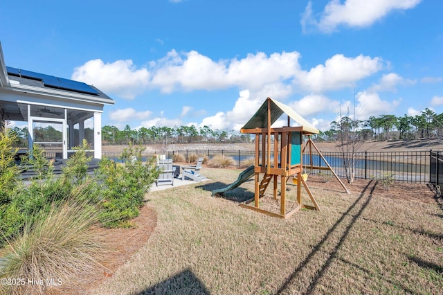 1066 Bradshaw Ter, Wilmington, NC 28412 - view of play area with a yard, a sunroom, and a fenced backyard