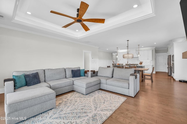 1066 Bradshaw Ter, Wilmington, NC 28412 - living area featuring a ceiling fan, a raised ceiling, crown molding, and recessed lighting