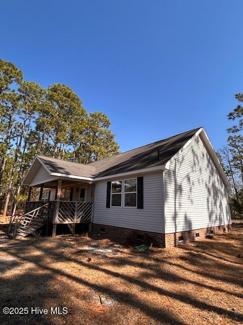 exterior space with crawl space