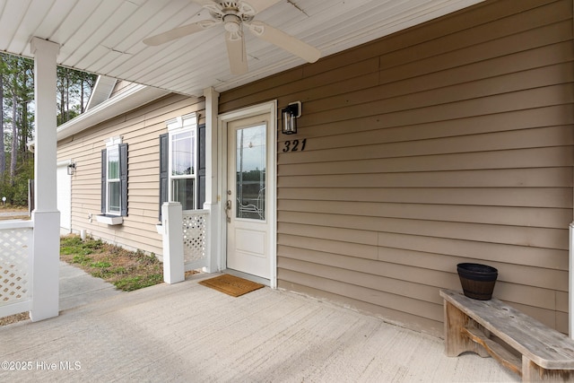 view of exterior entry with ceiling fan