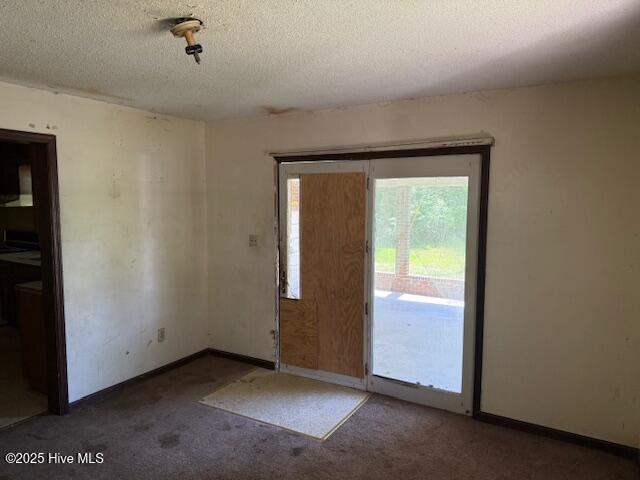 350 Randolphville Rd NE, Bolivia, NC 28422 - carpeted spare room featuring baseboards, a textured ceiling, and visible vents