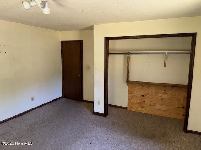 350 Randolphville Rd NE, Bolivia, NC 28422 - unfurnished bedroom with carpet flooring, a ceiling fan, baseboards, and a closet