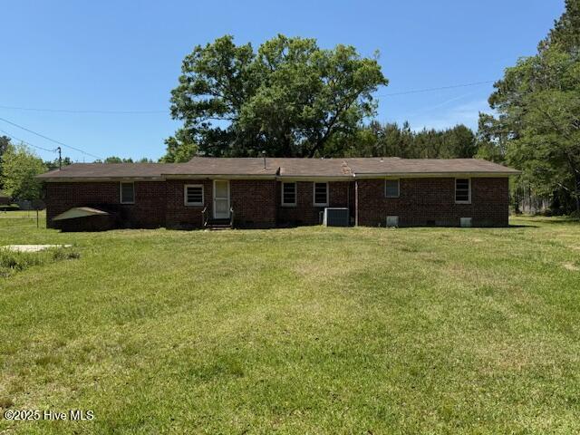 350 Randolphville Rd NE, Bolivia, NC 28422 - ranch-style home with brick siding, crawl space, central AC unit, and a front yard