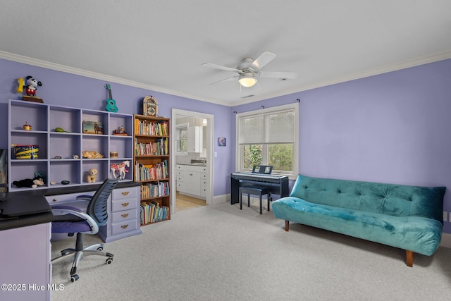 carpeted office space featuring baseboards, ceiling fan, and ornamental molding