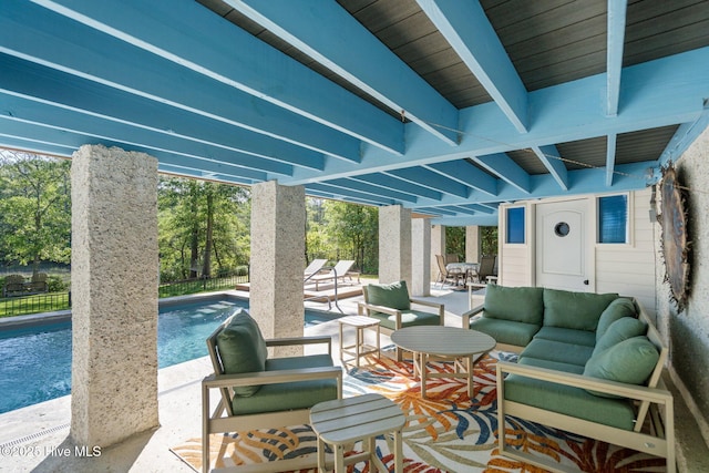 view of patio featuring a fenced in pool, outdoor lounge area, and fence
