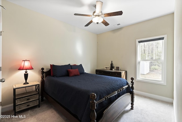 bedroom with a ceiling fan, carpet flooring, baseboards, and visible vents