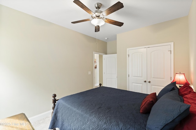 bedroom featuring a closet, baseboards, carpet, and a ceiling fan