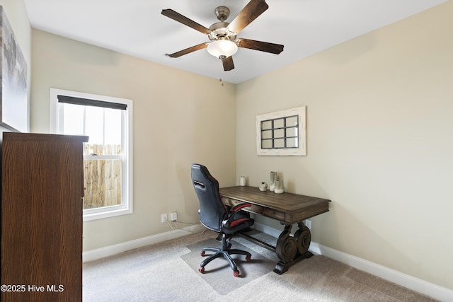 office space featuring carpet flooring, baseboards, and ceiling fan